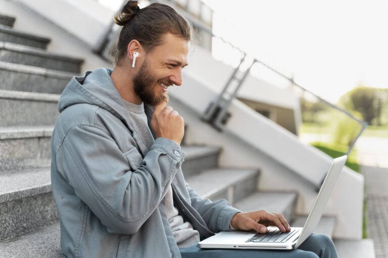 man-working-his-laptop-his-scooter